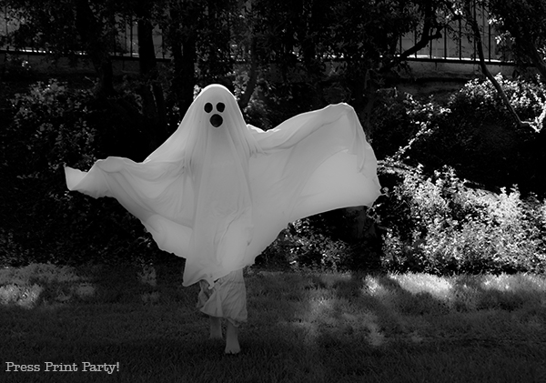 Easy ghost costume tutorial - kid in ghost sheet costume Press Print Party. bed sheet ghost costume DIY