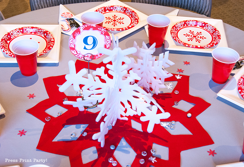 DIY Christmas Centerpiece Ideas red snowflake red and white table number. White foam snowflakes on table. table number 9 - Press Print Party!