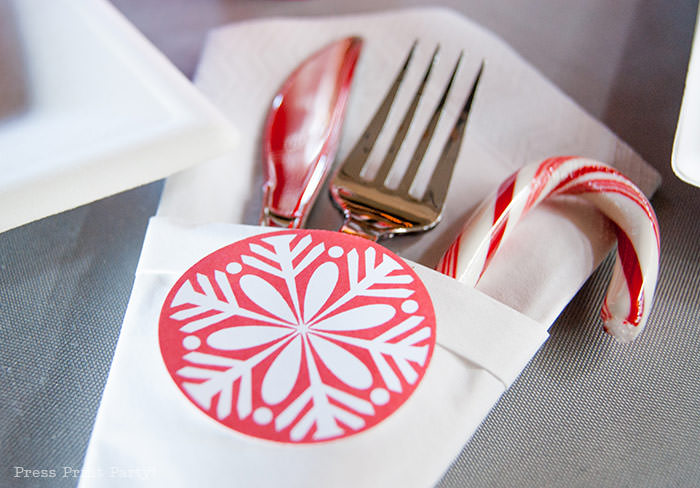 DIY Christmas Centerpiece Ideas red snowflake fork and knife and candy cane in white napkin Press Print Party!