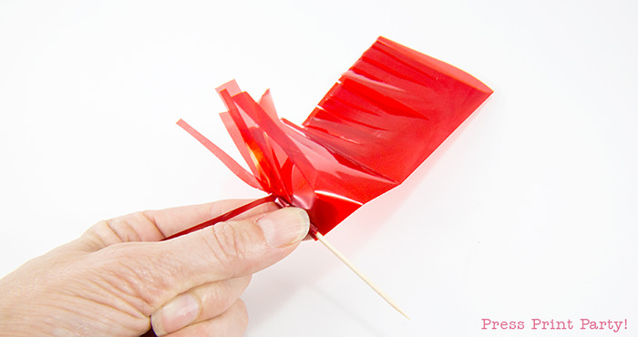 Rolling your tassel cupcake toppers.