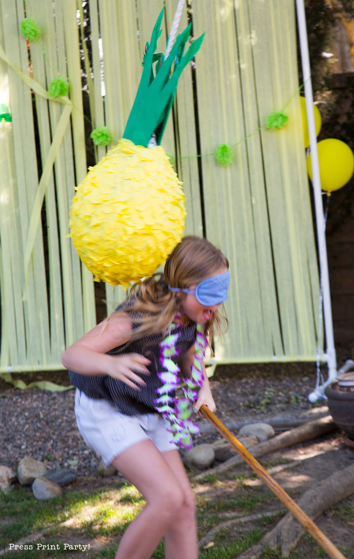 Pineapple Pinata Tutorial, the good, the bad and the funny! How to make a pineapple pinata. By Press Print Party! Girl swinging at pinata