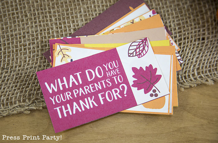 Free Thanksgiving printable conversation cards for Thanksgiving dinner activity. Game for Thanksgiving. free printable Thanksgiving ideas for dinner. What to do at Thanksgiving dinner. With questions to boost conversation. Fall leaves design. Put them in a jar with label. Press Print Party! What are you thankful for? What do you have your parents to thank for?