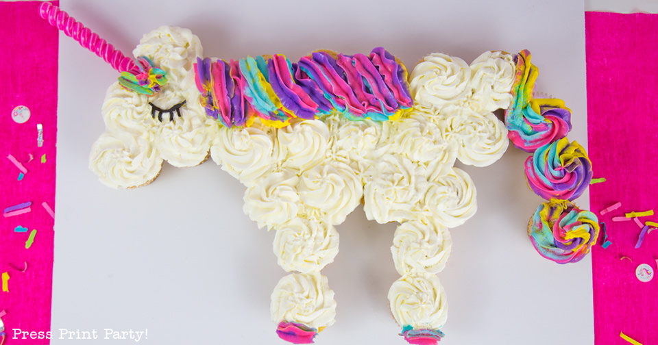 White Unicorn cupcake cake with rainbow swirl frosting for the mane and tail. 