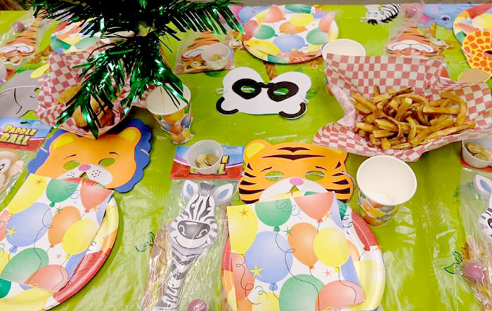 Jungle party tablescape with animal masks