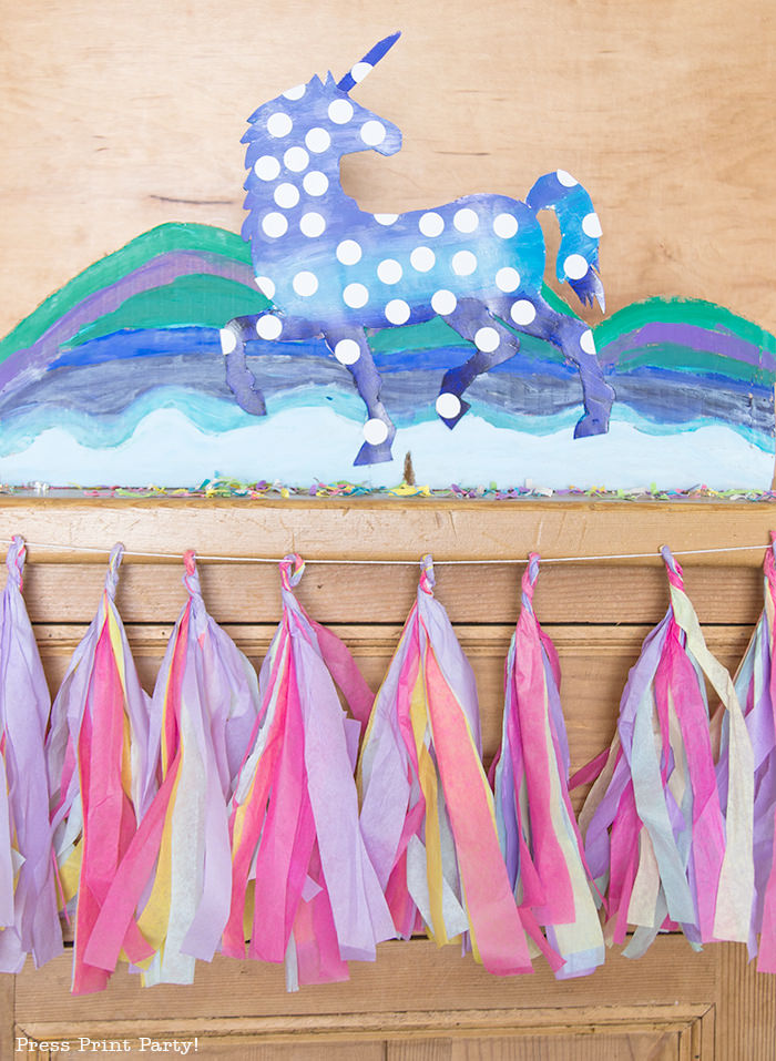 multicolored tassels on buffet with unicorn