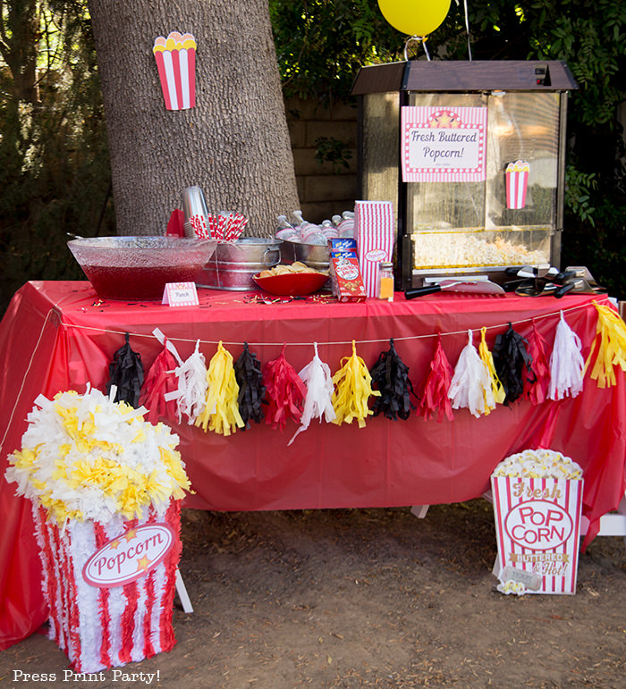 Backyard movie night party ideas - Movie night cupcakes with popcorn - Printables by Press Print Party!
