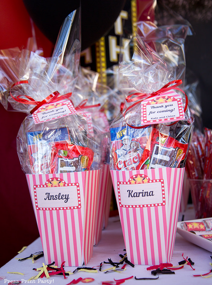 Movie night favors in popcorn boxes with tags. Printables by Press Print Party!