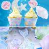 Mermaid cupcakes. Printable cupcake toppers and wrappers. 2 cupcakes with mermaid tail and shells topper. Printables by Press Print Party!