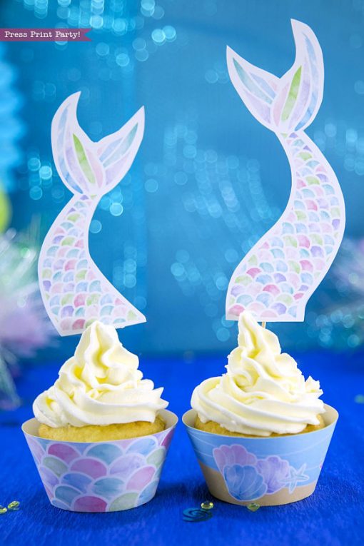 Mermaid cupcakes with scales wrapper and long mermaid tail topper. Printables by Press Print Party!