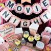movie night printables full set with banner, popcorn boxes, ticket invitation, cupcakes, sign, hat and more
