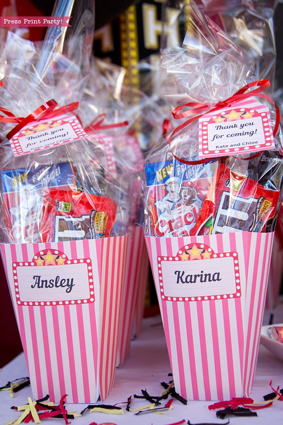 Movie Night Popcorn boxes favor boxes filled with favors and a tag. Press Print Party!