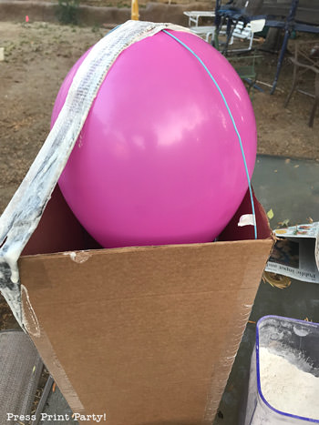 Balloon in a box to make a popcorn box pinata - Press Print Party!
