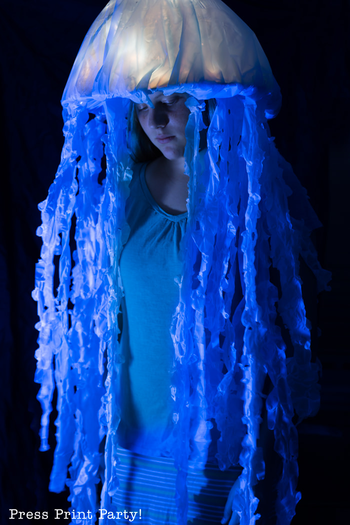 Girl with light up jellyfish costume at night. Press Print Party!