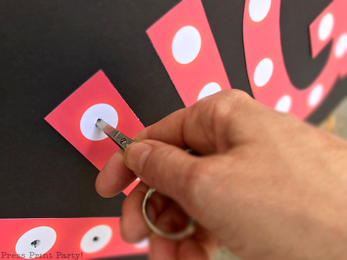 Making holes in the movie night marquee - Press Print Party!