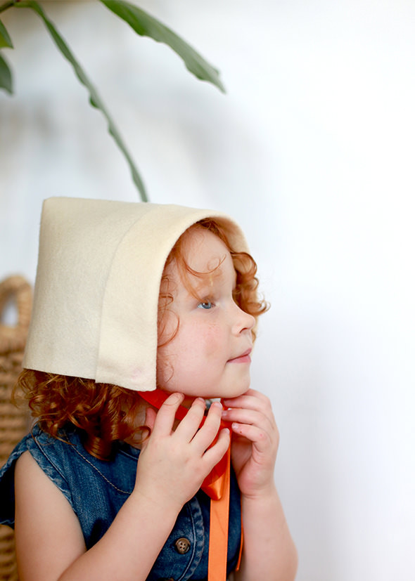 Girl with bonnet made out of felt