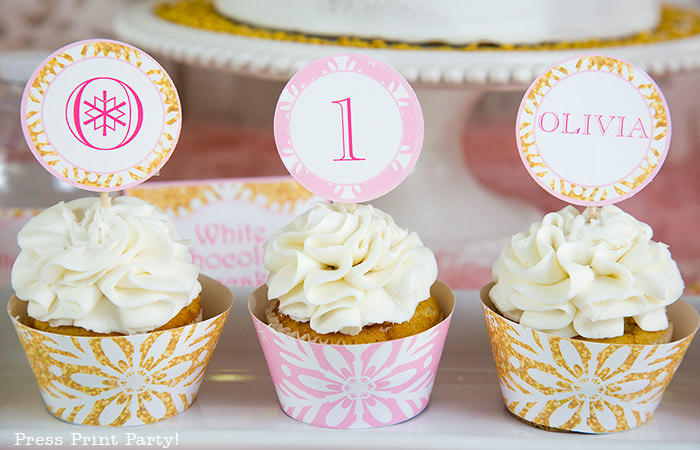 winter onederland birthday party cupcakes with pink wrappers and gold wrappers and editable toppers. - Press Print Party!