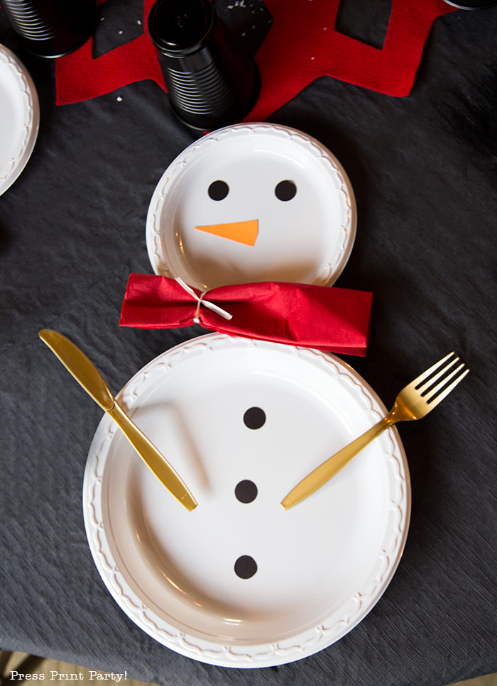 snowman made with white plates and a red napkin scarf - Press Print Party!
