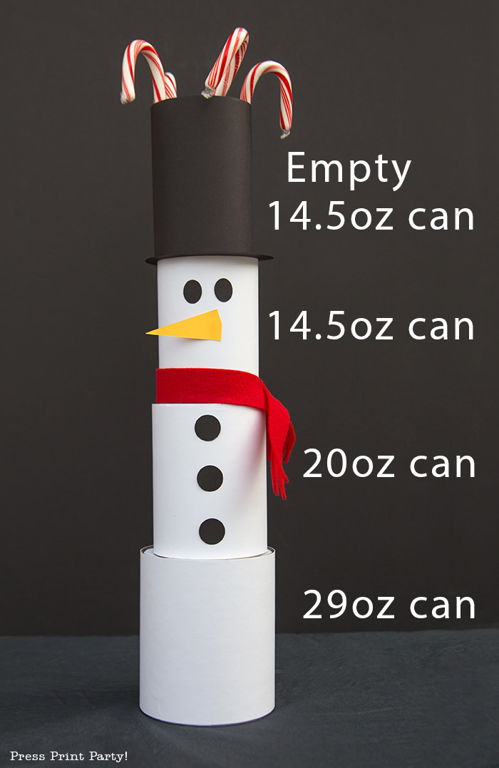 cute Christmas snowman made with cans and felt scarf with black background and size of cans used- Press Print Party!