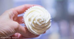 Cupcake frosted with white Swiss meringue buttercream frosting - Press Print Party!