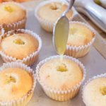 Filling lemon cupcakes with lemon curd