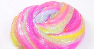 Foolproof slime recipe, striped slime with clear and glitter slime made with glue and contact solution.