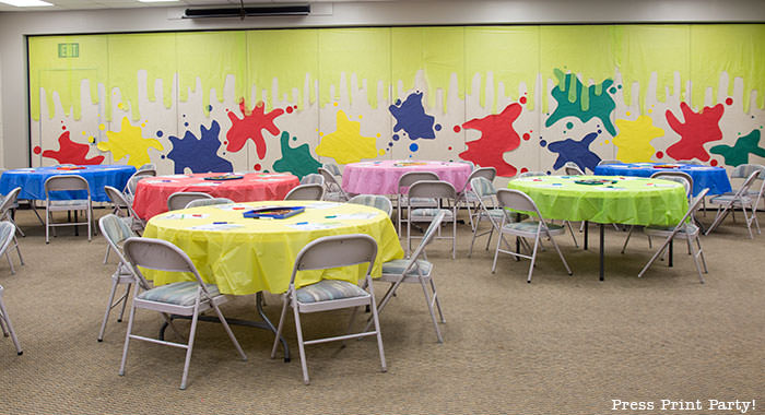 slime walls with paper and plastic tablecloth backdrop -Science party decoration ideas DIY -Press Print Party!