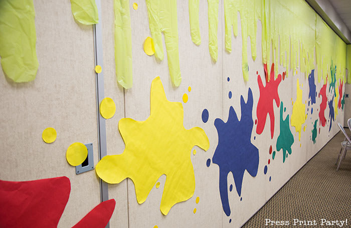 slime walls with paper and plastic tablecloth backdrop -Science party decoration ideas DIY -Press Print Party!