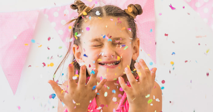 girls throwing confetti - classic games for kids parties - press print party