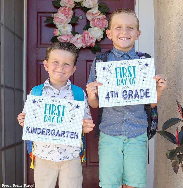 FREE First day of school signs printable - Back to school photo ideas - picture of 2 boys. First day of kindergarten and first day of 4th grade.by Press Print Party!