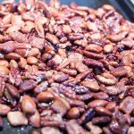 crunchy keto trail mix recipe with catalina crunch cereal, almonds, cocoa nibs, serve, and pecans.