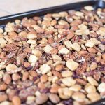 before oven. crunchy keto trail mix recipe with catalina crunch cereal, almonds, cocoa nibs, serve, and pecans.