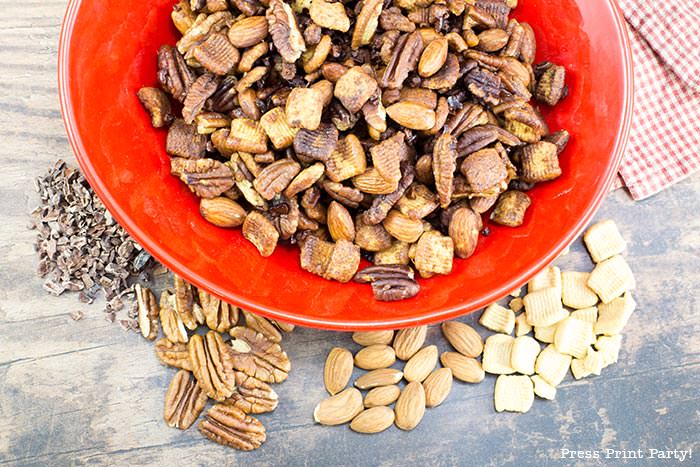 crunchy keto trail mix recipe with catalina crunch cereal, almonds, cocoa nibs, serve, and pecans.