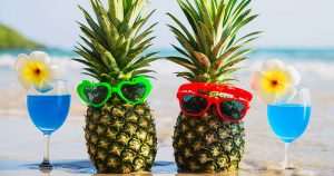 party on a budget food ideas 2 pineapple on the beach with a drink