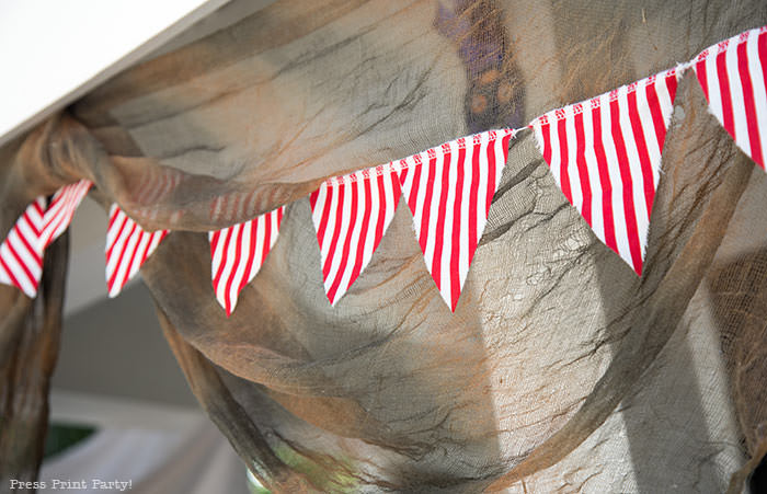 close up of pirate banner with red and white striped fabric. Press Print Party!