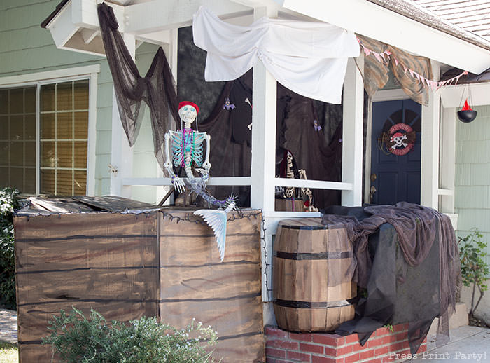 diy pirate ship- haunted pirate ship- Halloween porch decor ideas - Halloween Front porch ideas - Halloween porch decor - pirate decorations - Pirate skeleton - Mermaid skeleton - Press Print Party!