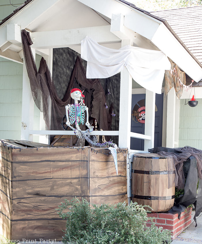 diy pirate ship- haunted pirate ship- Halloween porch decor ideas - Halloween Front porch ideas - Halloween porch decor - pirate decorations - Pirate skeleton - Mermaid skeleton - Press Print Party!