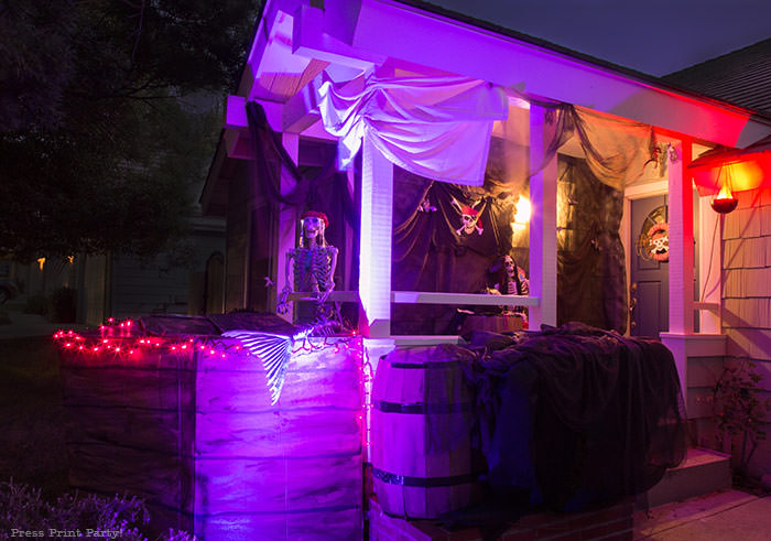 diy pirate ship at night- lighted haunted pirate ship- Halloween porch decor ideas - Halloween Front porch ideas - Halloween porch decor - pirate decorations - Pirate skeleton - Mermaid skeleton - Press Print Party!