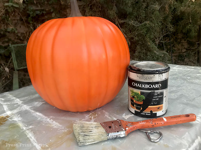 Painting an orange foam pumpkin with black chalkboard paint. and how to do the chalk lettering - Press Print Party!