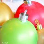 close up of balloon ornament for Christmas table centerpiece. Balloons with ornament toppers in green, gold, blue, red and hot pink. Press Print Party!