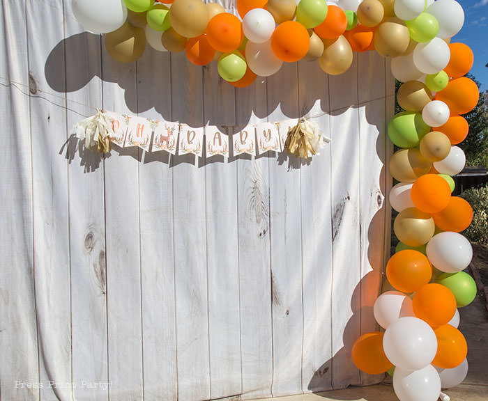 Oh baby banner woodland theme baby shower forest animals. with organic balloon garland in orange, gold, green, and white. White wood backdrop. Woodland Animals Baby Shower Theme with woodland creatures and forest animals party supplies. Woodland decoration girl baby shower ideas. Can be used for woodland birthday party. Rustic forest animals with flowers and antlers. Fox baby shower, Deer baby shower.