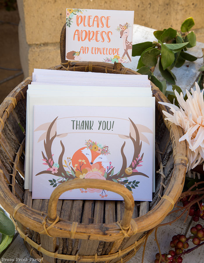 Woodland baby shower thank you note with cute fox and antlers and flowers. in a basket with a note on a place card. Woodland animals Baby Shower Theme with woodland creatures and forest animals party supplies. Woodland decoration girl baby shower ideas. Can be used for woodland birthday party. Rustic forest animals with flowers and antlers. Fox baby shower, Deer baby shower.