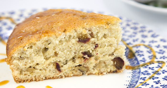 piece of old fashioned date cake with caramel sauce on blue plate - Press Print Party!