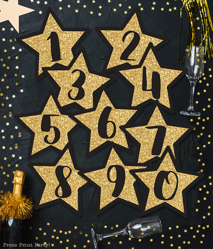 Free New year's printable banner. make for any year. For your new years eve party.all numbers included. large Gold star with black numbers. free printable by Press Print Party! Happy new year!
