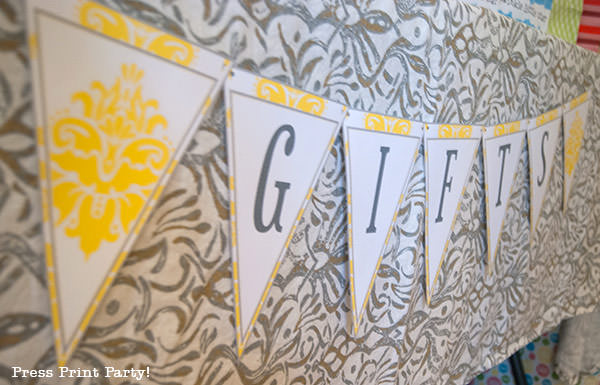 yellow and grey banner for gifts at part table.