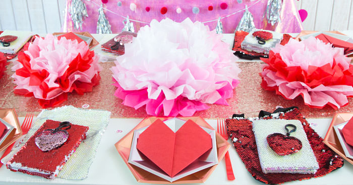 Galentine's Day table with sequins table runner, tissue paper flower, heart napkins hexagonal plates. flip sequins favors - Press Print Party!