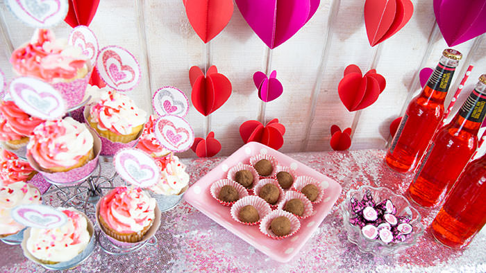 Dessert table with chocolate truffles and cupcakes - Galentine's Day Party Ideas for Teens - Press Print Party!