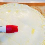 egg wash on the Authentic galette des rois recipe - French kings cake pastry with almond paste. French tradition, French style kings cake. easy to make with golden crown by Press Print Party!