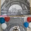 Paris Party desert table with paris party printables. Eiffel tower backdrop and centerpiece with cupcakes and french flag. Vintage French Party decorations and treats. With Paris banner and red whit and blue balloons. Press Print Party!