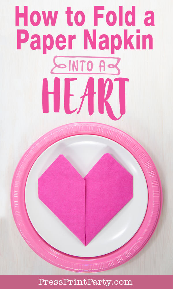 Heart Fold Napkin instructions- How to fold a napkin like a heart - paper napkin or cloth napkins - By Press print Party. Pink paper napkin folded like a heart DIY tutorial