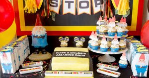 The amazing race party ideas - birthday party table with cake and tavelocity gnomes. Press Print Party!